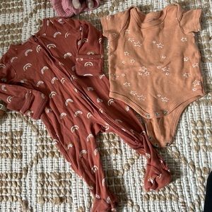 Two neutral onesies. 6 months and 6-9 months. Worn a few times.